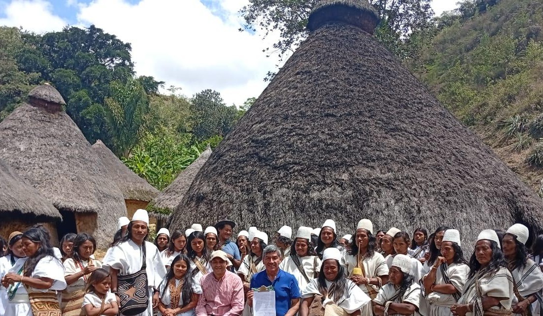 Arhuaco community gathered in front of ancestral houses in the Sierra Nevada